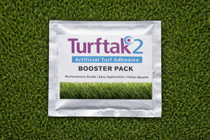 Turftak2 Artificial Turf Adhesive Booster Pack on a grass background